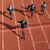 Businessmen running to the finish line